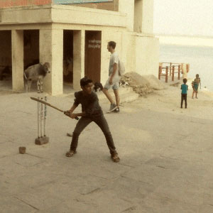 kids playing gully cricket on ghats of Varanasi
