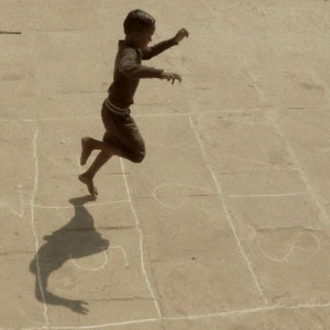 children playing Stapoo (Hopscotch) on ghats of Varanasi